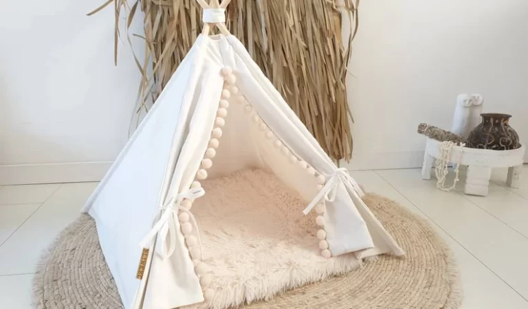 A charming cat teepee featuring a cozy fabric tent with a wooden frame, offering a private retreat for your feline companion