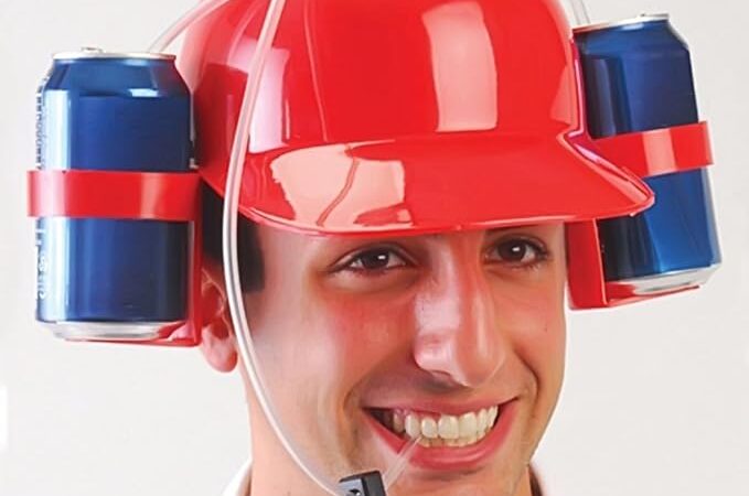 A novelty drinking helmet is a fun, quirky accessory that holds two beverage cans on either side, connected to straws for hands-free drinking